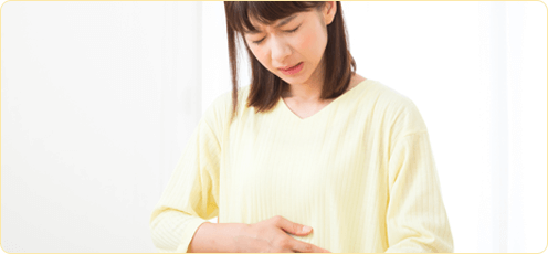 胃腸が不調の女性